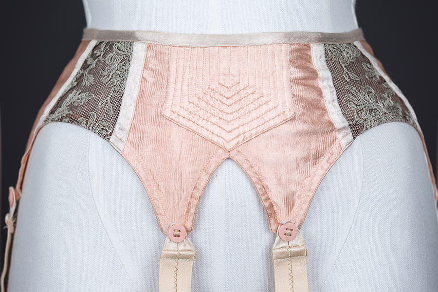 Quilted satin and embroidered tulle suspender belt - front panel close up. Photography by Tigz Rice Studios