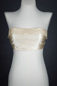 Satin bandeau bra with tripartate strapping by The Modishform, c. late 1910s The Underpinnings Museum shot by Tigz Rice Studios 2017