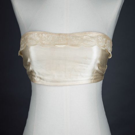 Satin bandeau bra with tripartate strapping by The Modishform, c. late 1910s The Underpinnings Museum shot by Tigz Rice Studios 2017