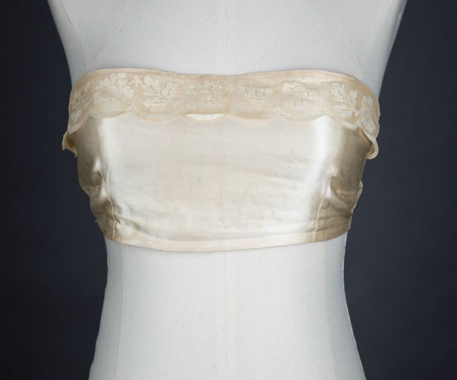 Satin bandeau bra with tripartate strapping by The Modishform, c. late 1910s The Underpinnings Museum shot by Tigz Rice Studios 2017