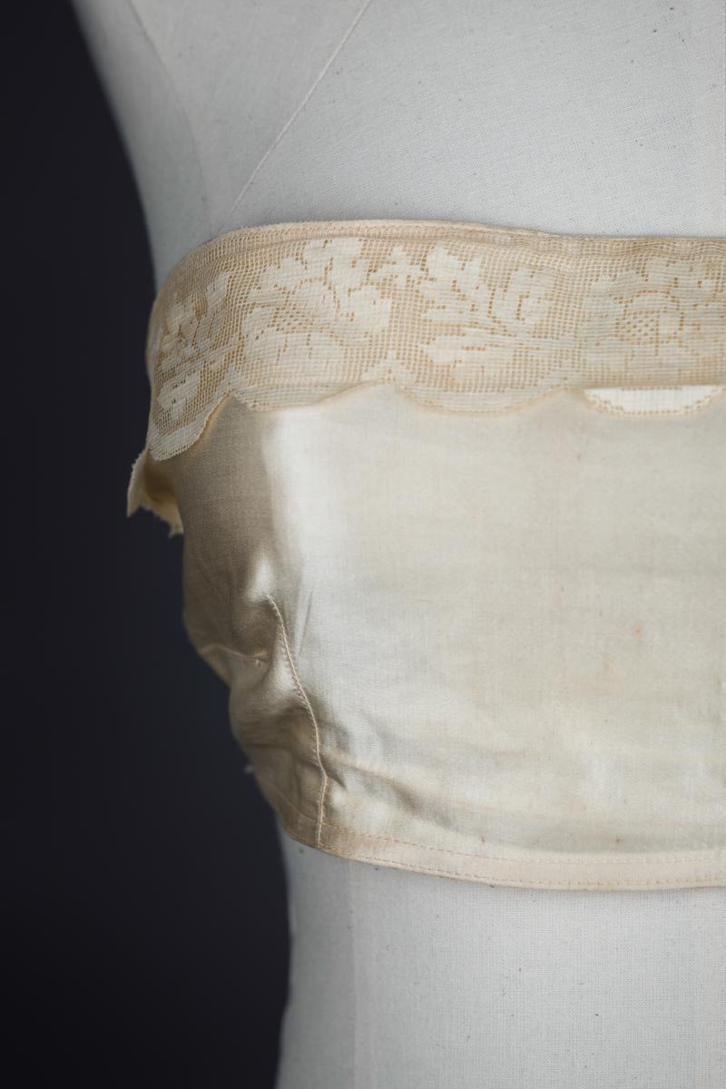 Satin bandeau bra with tripartate strapping by The Modishform, c. late 1910s The Underpinnings Museum shot by Tigz Rice Studios 2017