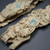 Hand painted silk bridal garters, c.1890s, USA. Photography by Tigz Rice Studios. From The Underpinnings Museum Collection.
