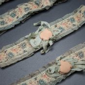 1920s floral ribbon garters with padding and rosettes, c. 1920s. USA Photography by Tigz Rice Studios. From The Underpinnings Museum collection.