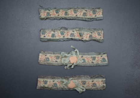 1920s floral ribbon garters with padding and rosettes, c. 1920s. USA Photography by Tigz Rice Studios. From The Underpinnings Museum collection.