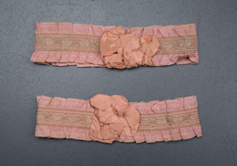 Pink ruffle elastic garters with silk rosettes, c. 1920s, USA Photography by Tigz Rice Studios. From The Underpinnings Museum Collection.