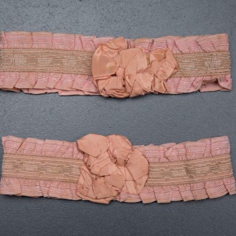 Pink ruffle elastic garters with silk rosettes, c. 1920s, USA Photography by Tigz Rice Studios. From The Underpinnings Museum Collection.