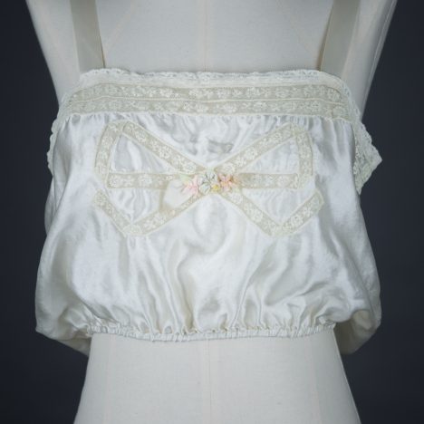Bow Lace Insertion & Ribbonwork Silk Corset Cover, c. 1920s, USA Photography by Tigz Rice Studios. From The Underpinnings Museum collection.