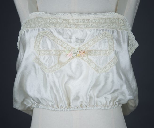 Bow Lace Insertion & Ribbonwork Silk Corset Cover, c. 1920s, USA Photography by Tigz Rice Studios. From The Underpinnings Museum collection.
