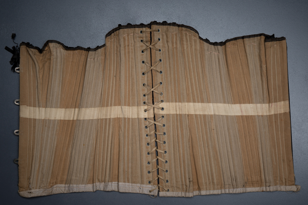 Black cotton working woman's corset, c.1900, Great Britain. The Underpinnings Museum, Photo by Tigz Rice
