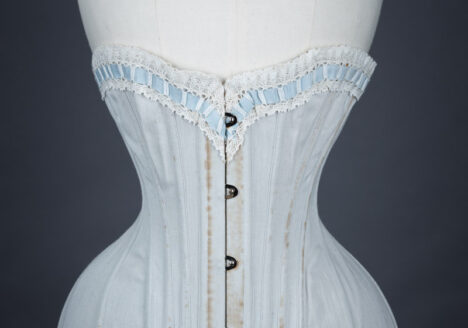 Grey herringbone coutil corset with ribbon slot lace trim, c. 1900-5, France. From The Underpinnings Museum collection. Photography by Tigz Rice.