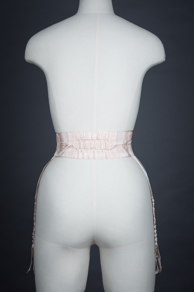 Pink Grosgrain Ribbon Suspender Belt, c. 1910s. The Underpinnings Museum. Photo by Tigz Rice