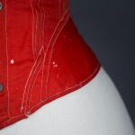 Red midbust corset with flossing and gores, c.1860s From The Underpinning Museum collection Photography by Tigz Rice