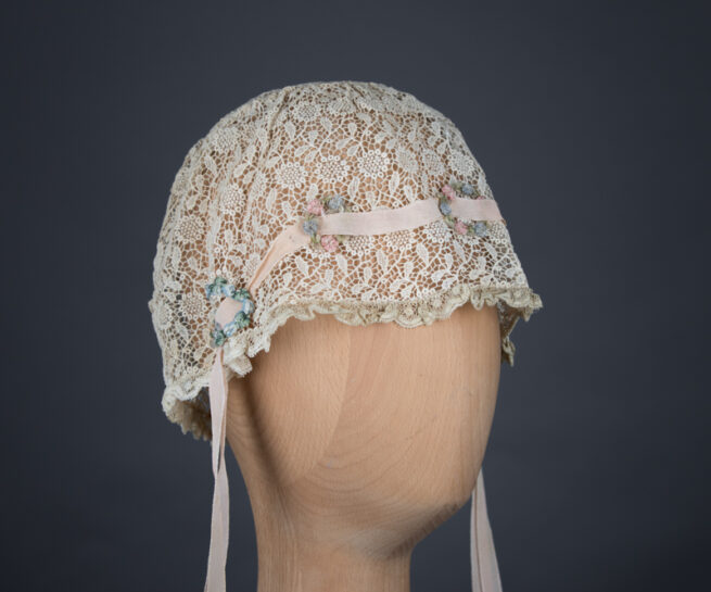 Chemical lace boudoir cap with ribbonwork, c. 1920s, GB, The Underpinnings Museum. Photo by Tigz Rice