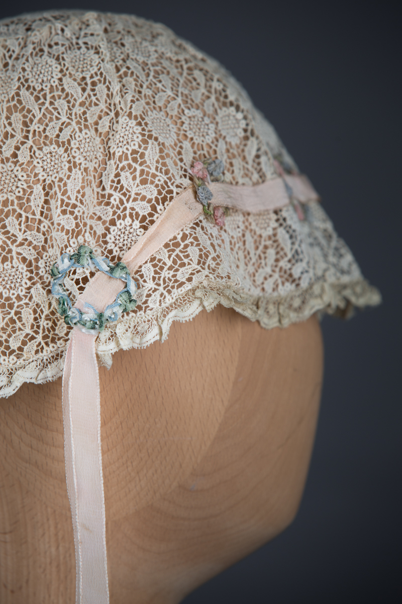 Chemical lace boudoir cap with ribbonwork, c. 1920s, GB, The Underpinnings Museum. Photo by Tigz Rice