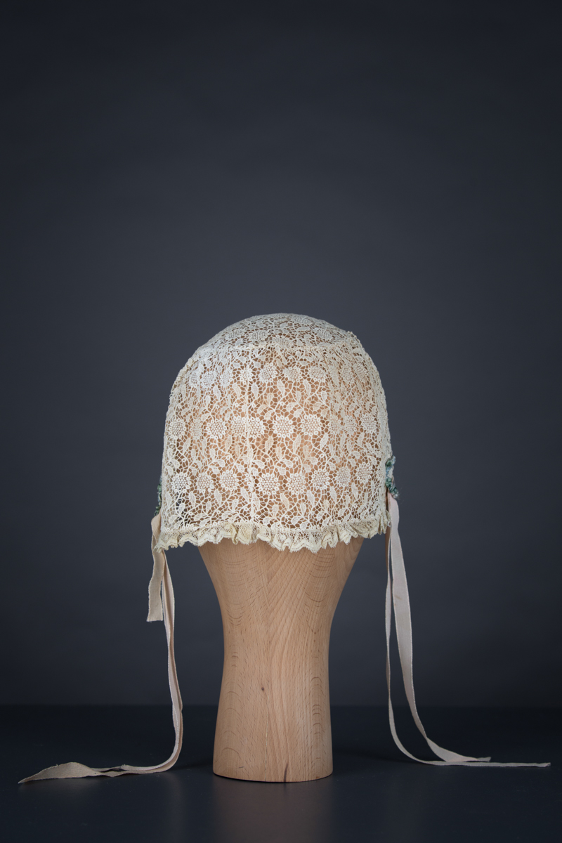 Chemical lace boudoir cap with ribbonwork, c. 1920s, GB, The Underpinnings Museum. Photo by Tigz Rice