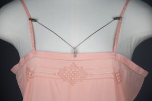 Engraved lingerie clips, c. 1920s. The Underpinnings Museum. Photo by Tigz Rice