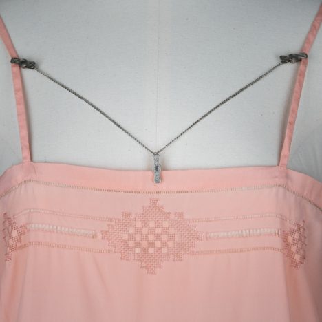 Engraved lingerie clips, c. 1920s. The Underpinnings Museum. Photo by Tigz Rice