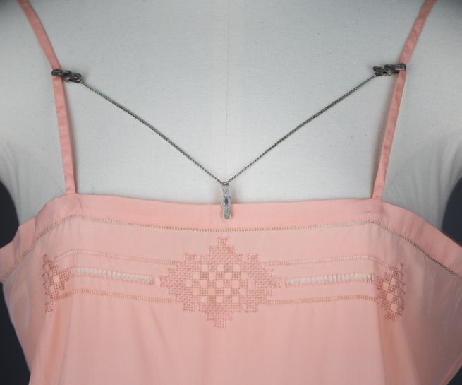 Engraved lingerie clips, c. 1920s. The Underpinnings Museum. Photo by Tigz Rice