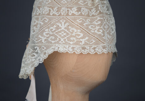 Filet lace boudoir cap, c. 1910s, GB. The Underpinnings Museum. Photo by Tigz Rice