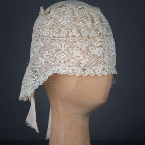 Filet lace boudoir cap, c. 1910s, GB. The Underpinnings Museum. Photo by Tigz Rice