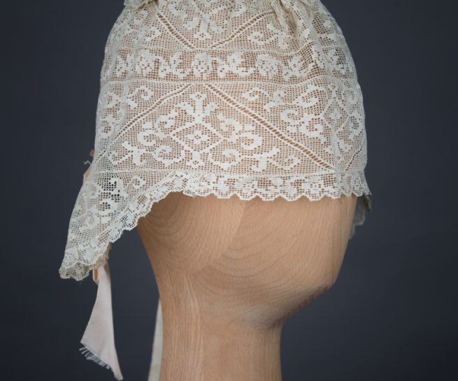 Filet lace boudoir cap, c. 1910s, GB. The Underpinnings Museum. Photo by Tigz Rice