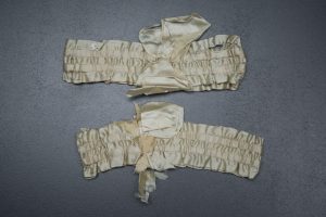 Ivory silk ribbon garters, c. 1920s, USA, The Underpinnings Museum, Photo by Tigz Rice