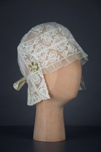 Lace, tulle and silk bow boudoir cap, c. 1910s, Au Bon Marché, France. The Underpinnings Museum, Photo by Tigz Rice