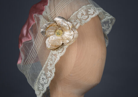 Tulle & silk boudoir cap with oversized flowers, c. 1920s, USA. The Underpinnings Museum. Photo by Tigz Rice