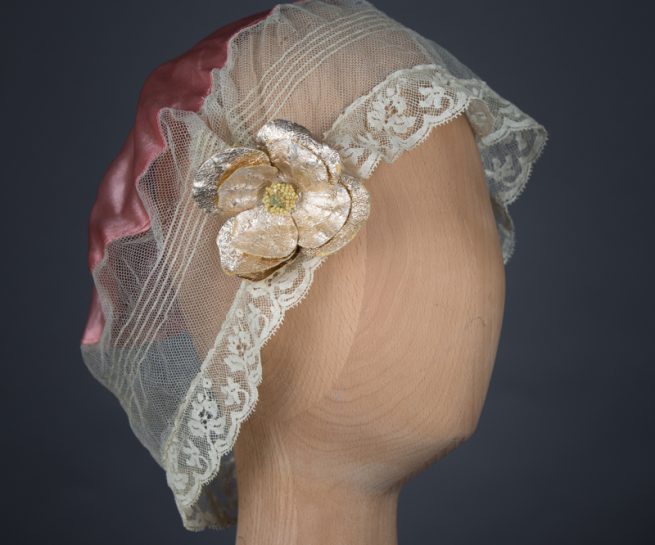 Tulle & silk boudoir cap with oversized flowers, c. 1920s, USA. The Underpinnings Museum. Photo by Tigz Rice
