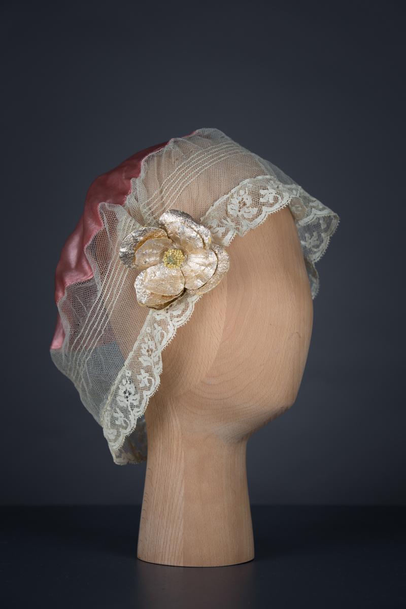 Tulle & silk boudoir cap with oversized flowers, c. 1920s, USA. The Underpinnings Museum. Photo by Tigz Rice