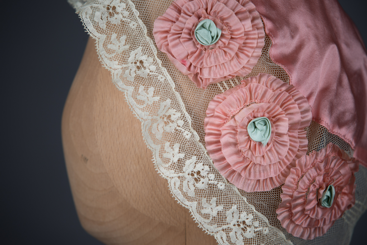 Tulle & silk boudoir cap with oversized flowers, c. 1920s, USA. The Underpinnings Museum. Photo by Tigz Rice