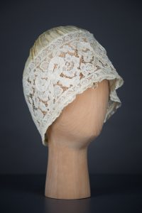 Yellow Silk, Lace & Ribbonwork Bow Appliqué Boudoir Cap, c. 1910s, Great Britain. The Underpinnings Museum. Photo by Tigz Rice