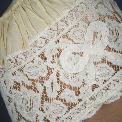 Yellow Silk, Lace & Ribbonwork Bow Appliqué Boudoir Cap, c. 1910s, Great Britain. The Underpinnings Museum. Photo by Tigz Rice
