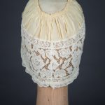 Yellow Silk, Lace & Ribbonwork Bow Appliqué Boudoir Cap, c. 1910s, Great Britain. The Underpinnings Museum. Photo by Tigz Rice