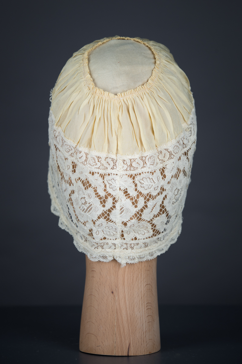 Yellow Silk, Lace & Ribbonwork Bow Appliqué Boudoir Cap, c. 1910s, Great Britain. The Underpinnings Museum. Photo by Tigz Rice