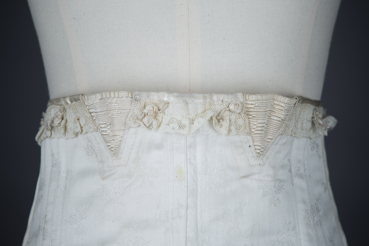 Front Lacing Brocade Girdle With Elastic Gussets & Ribbonwork, c. 1920s, Spain. The Underpinnings Museum. Photography by Tigz Rice