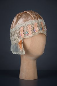 Rayon Satin & Silk Ribbonwork Boudoir Cap, c. 1920s, UK. The Underpinnings Museum. Photography by Tigz Rice