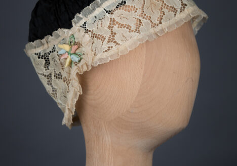 Shirred Black Silk & Ecru Lace Boudoir Cap, c.1920s, UK. The Underpinnings Museum. Photography by Tigz Rice
