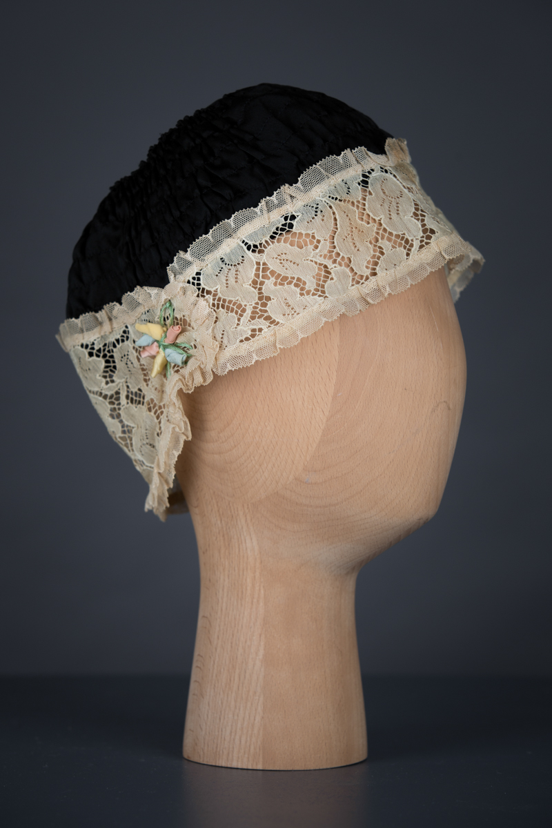 Shirred Black Silk & Ecru Lace Boudoir Cap, c.1920s, UK. The Underpinnings Museum. Photography by Tigz Rice