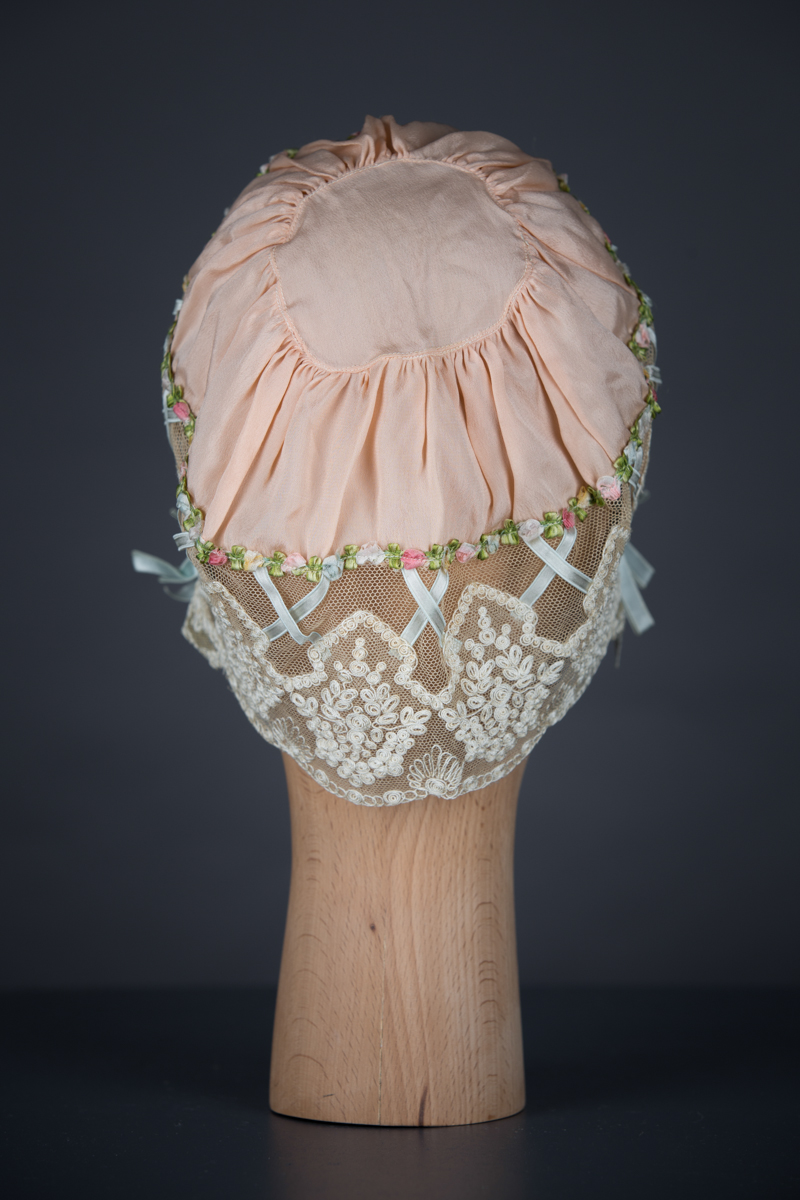 Silk & Schiffli Embroidery Boudoir Cap With Ribbon Lattice, c. 1920s, UK. The Underpinnings Musuem. Photography by Tigz Rice
