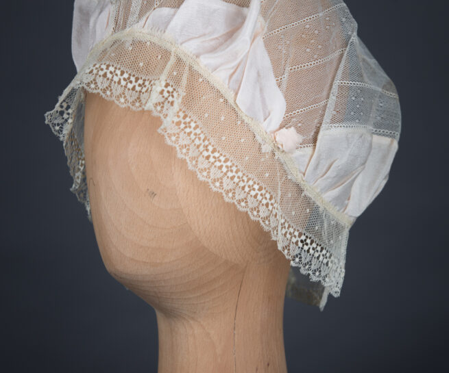 Silk Habotai & Lace Boudoir Cap With Silk Rosettes, c.1920s, UK. The Underpinnings Museum. Photography by Tigz Rice