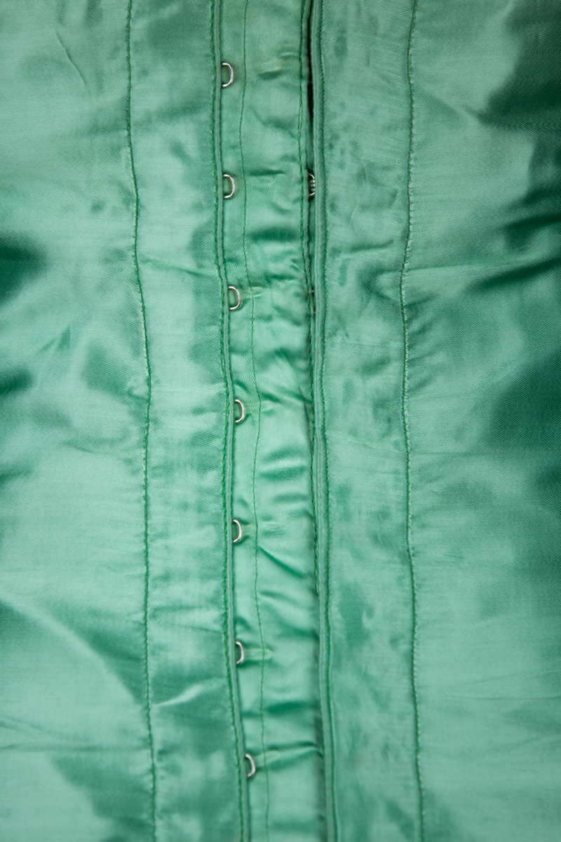 Green Rayon Satin Corselet With Freehand Quilting, c. 1950s, Poland. The Underpinnings Museum. Photography by Tigz Rice