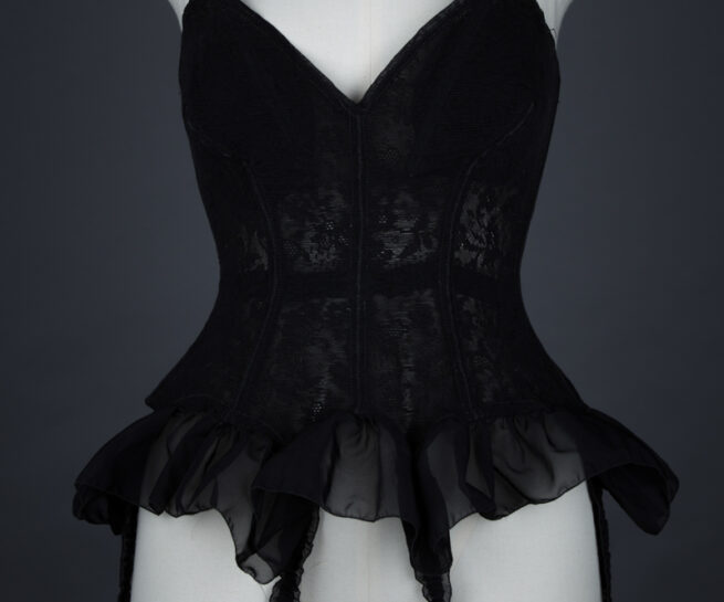 Black Floral Mesh Corselet With Nylon Flounce By Mador, c. 1950s, France. The Underpinnings Museum. Photography by Tigz Rice