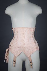 Pointed Tea Rose Brocade Coutil Girdle With Side Lacing, c. 1930s, France. The Underpinnings Museum. Photography by Tigz Rice