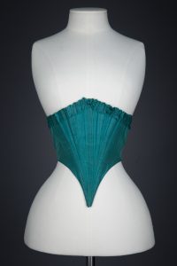 Green Silk Swiss Waist With Ruffled Trim, c. 1860s, USA. The Underpinnings Museum. Photography by Tigz Rice