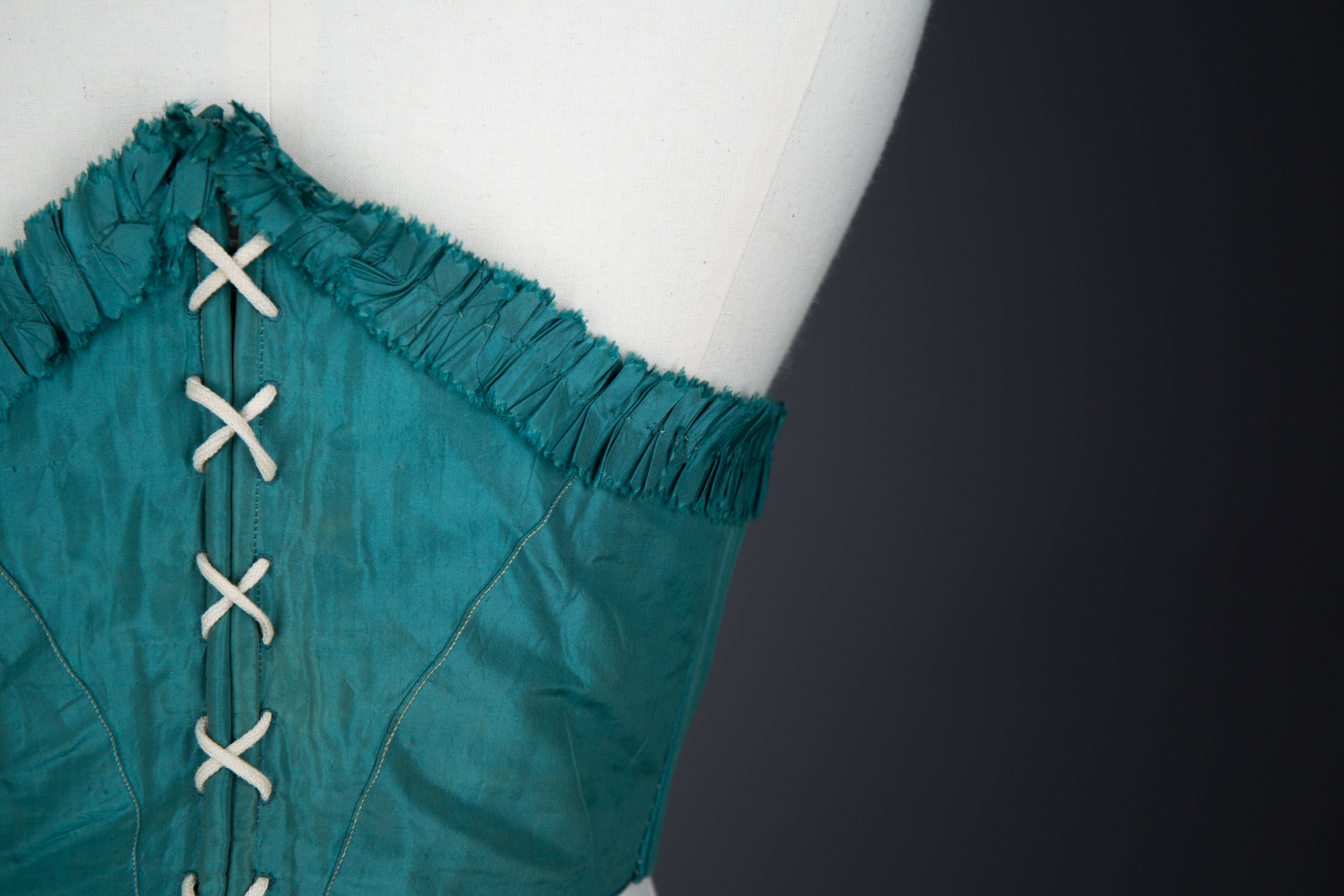 Green Silk Swiss Waist With Ruffled Trim, c. 1860s, USA. The Underpinnings Museum. Photography by Tigz Rice
