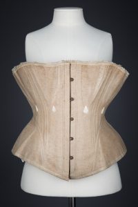 Ecru Cotton Twill Corset With Gores & White Flossing Embroidery, c. 1870s, Great Britain. The Underpinnings Museum. Photography by Tigz Rice.