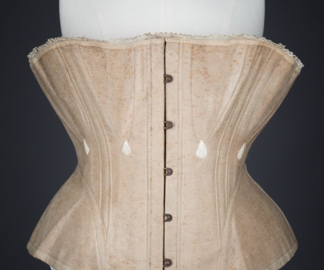 Ecru Cotton Twill Corset With Gores & White Flossing Embroidery, c. 1870s, Great Britain. The Underpinnings Museum. Photography by Tigz Rice.