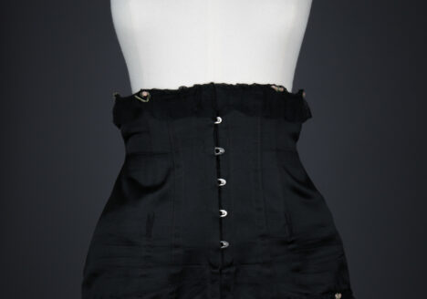 Black Silk Underbust Corset With Suspenders & Ribbonwork by Corsets "Guy" , c. 1920s, France. The Underpinnings Museum. Photography by Tigz Rice.