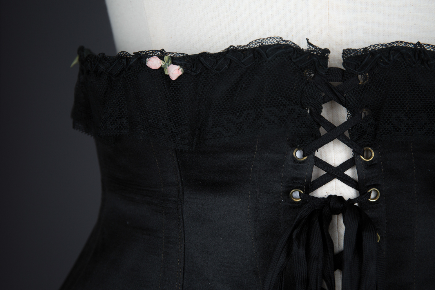 Black Silk Underbust Corset With Suspenders & Ribbonwork by Corsets "Guy" , c. 1920s, France. The Underpinnings Museum. Photography by Tigz Rice.